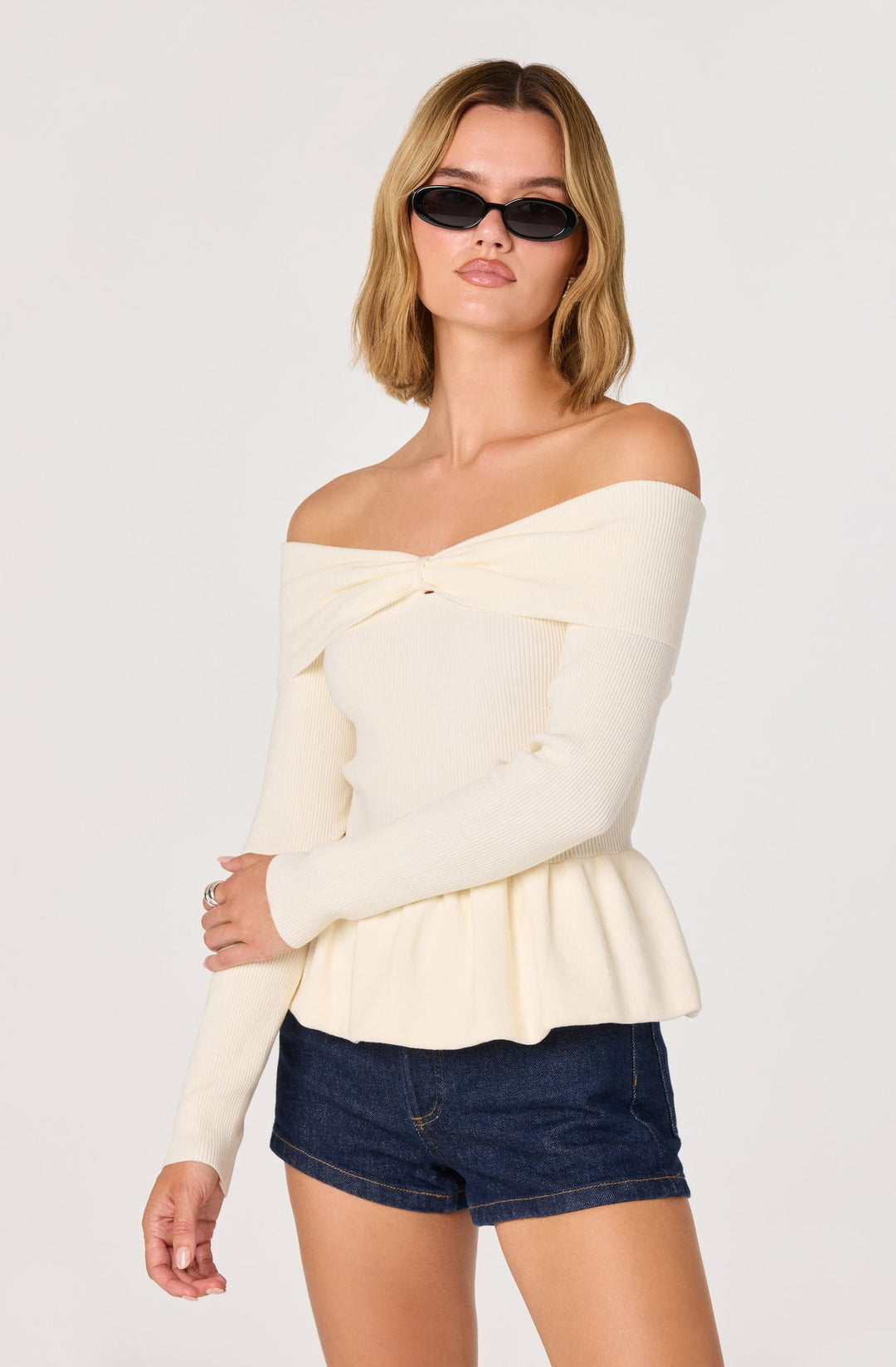 TIARRA PEPLUM SWEATER